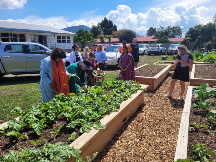 Photo 5_Hon Minister and representatives at the community garden